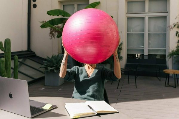 Office Worker holding a Yoga Ball